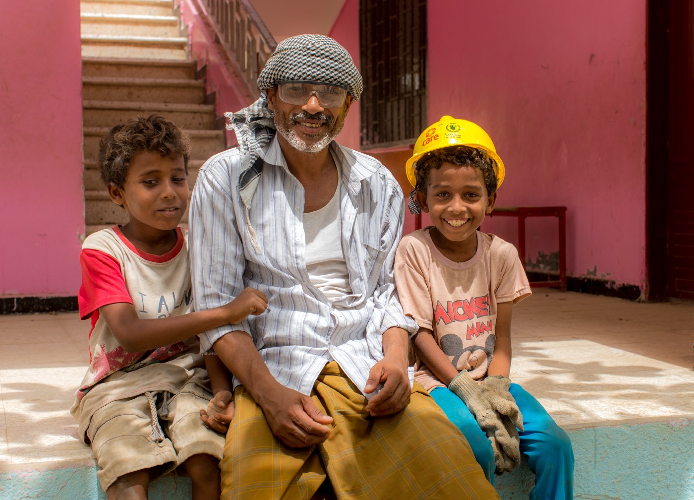 Lutfi and children at a rehabilitated school