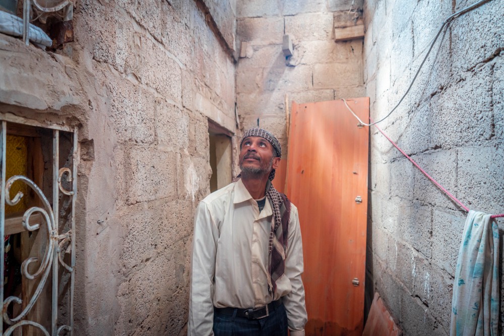 Saeed in his severely damaged home