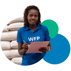 Young woman wearing a WFP branded t-shirt and holding paperworks