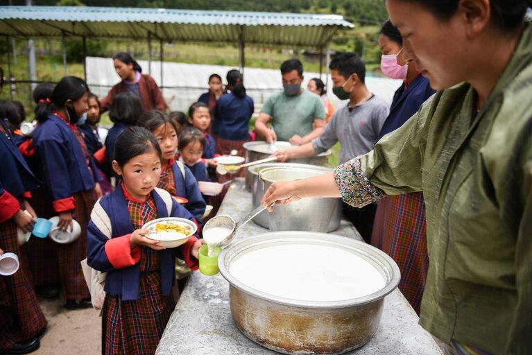 A Bhutan farmer grows food for her daughter’s school