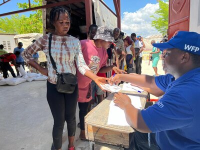 People are waiting on the line to get their food assistance in Cite Soliel, Haiti.