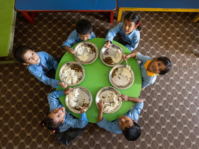 Photo: WFP A group of school children are having their school meals