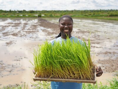 Woman holding her farm produce