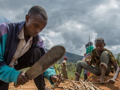 Men and women working on a community land