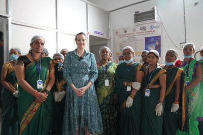 a group of women at a food distribution in India