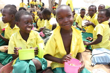 WFP/Martin Karimi Boys eating food