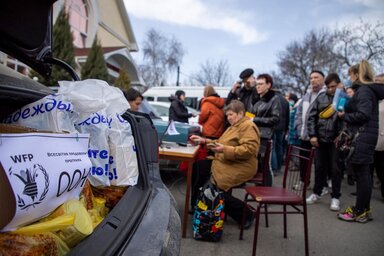 Ukraine. Hundreds of people receive food items from WFP, OCHA and Local partner