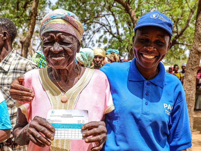 A beneficiary with a WFP staff