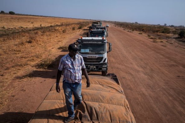 Photo: WFP/Gabriela Vivacqua. A WFP convoy leader inspects the cargo on a truck. Some 150 South Sudanese registered haulage companies are on WFP’s books. With a combined fleet of 8,200 trucks, they employ more than 16,600 South Sudanese truck drivers and assistants. These jobs provide much-needed income in many areas of the country