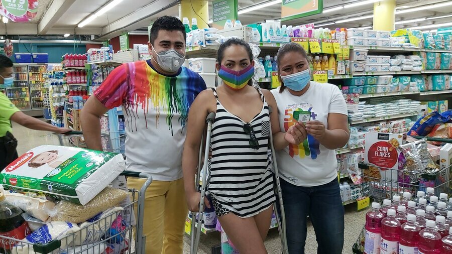 Supermarket swipe: Rubi Ferreira shows off her e-card— simple tasks such as shopping can be a huge challenge for trans people. Photo: WFP/Hetze Tosta