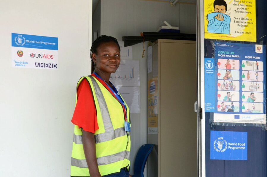 a woman in front of a health clinic