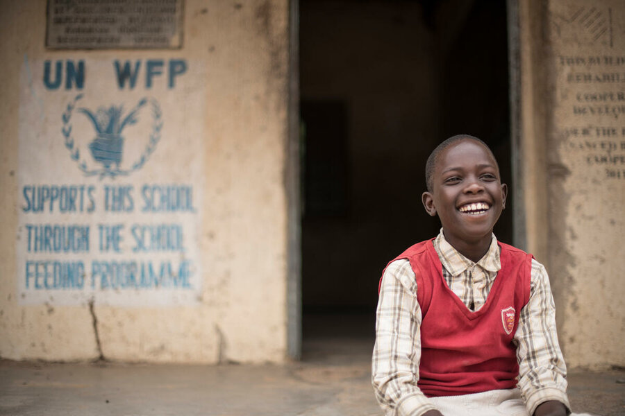 Boy at outside school in Uganda