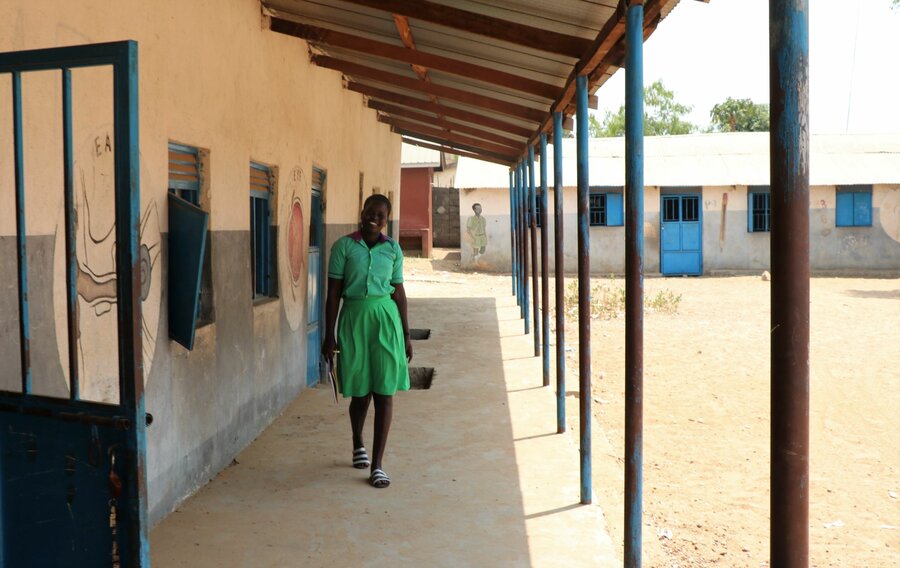 Achol Abraham Moun walks through the Muniki East Primary School in Juba. Photo: WFP/Musa Mahadi