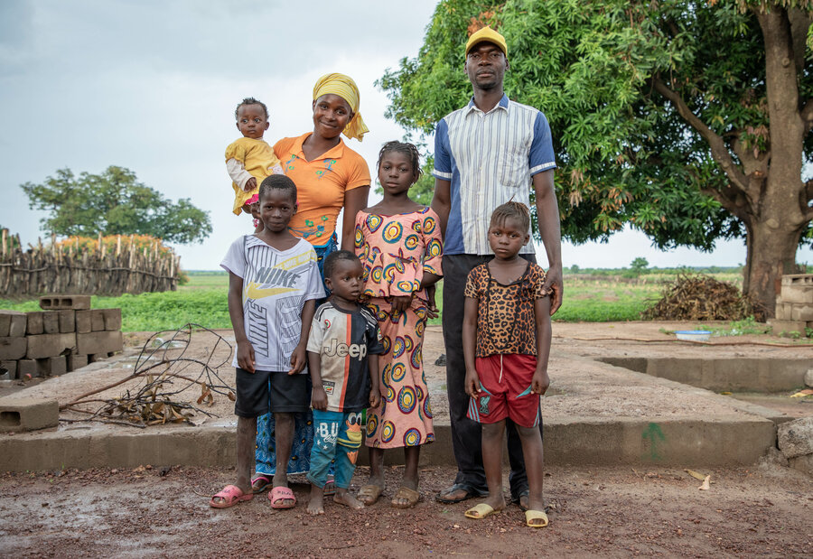 Family standing facing camera