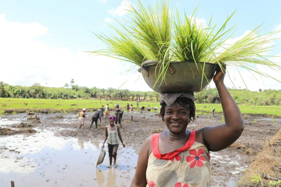 Woman with a big bowl on her head