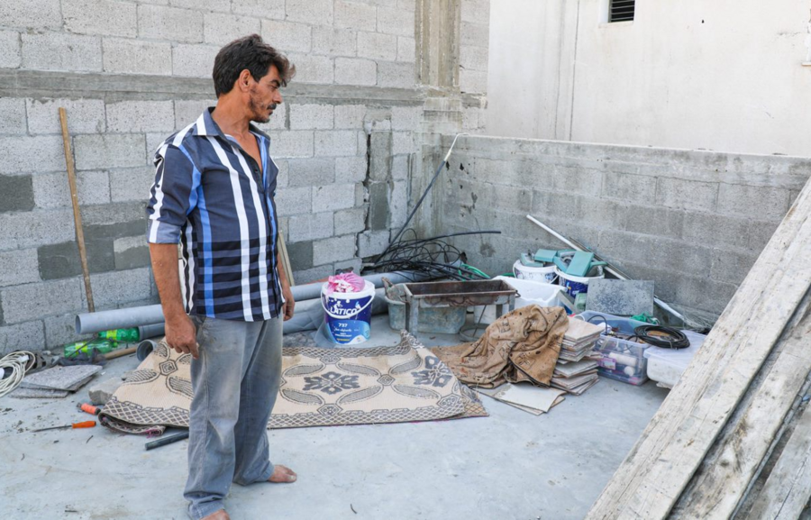 Ahmad shows us how he is now working to build it once again since it was partially destroyed by the escalation in Gaza in May. Photo: WFP/Nour Hammad