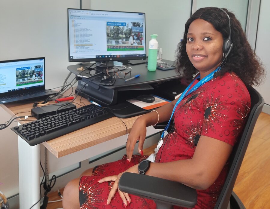 Woman sat behind desk in an office