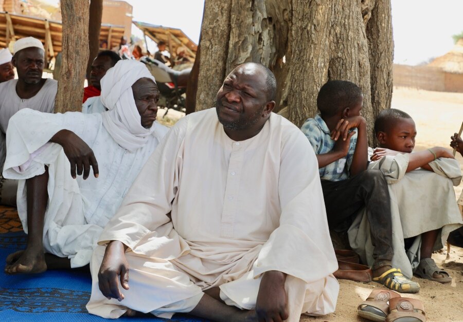 Ali Adam Ibrahim (forefront) left his homeland after hearing about news of fighting in Sudan's capital, Khartoum. Photo: WFP/Jacques David