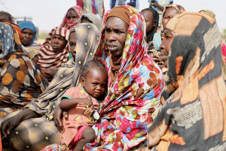 On the run: tens of thousands of people flee conflict-hit Sudan | World ...