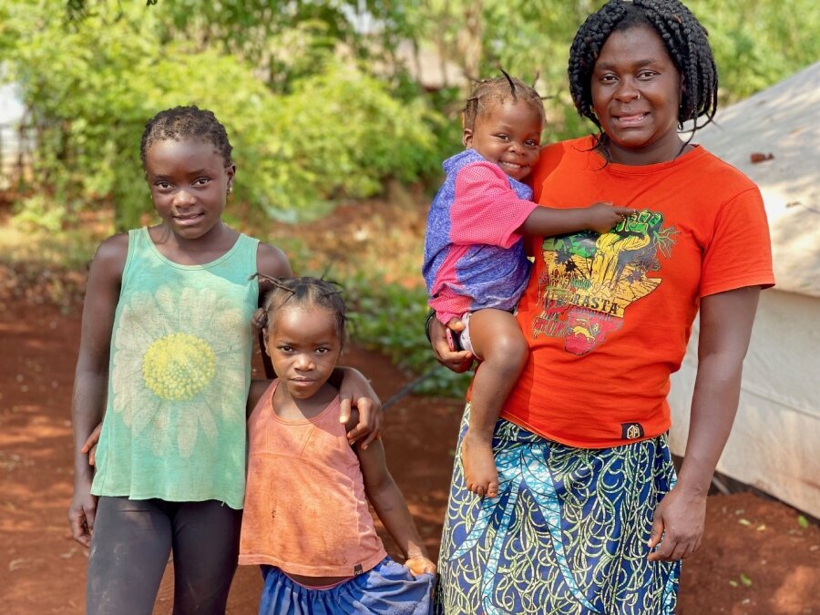 Deborah with daughters at Tanzania's Nduta refugee camp. Photo: WFP/Joseph Valerian