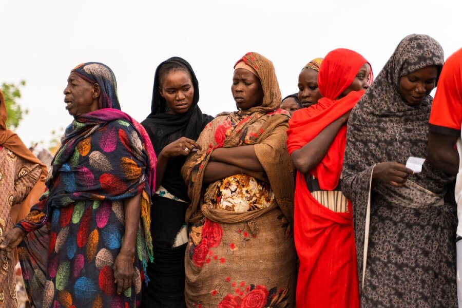 Women await WFP food assistance in Wad Madani, Sudan. The country's crisis is deepening already record hunger levels. Photo: OCHA/Ala Kheir 