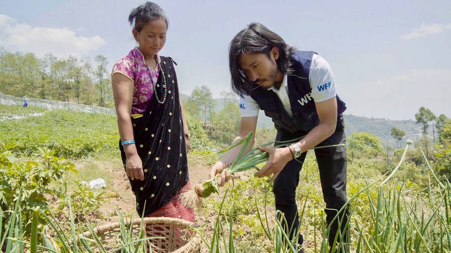 Farmer Krishna Maya (L) has been supplying vegetables to  Ganesh primary school for the past three years. Photo: WFP/Srawan Shrestha