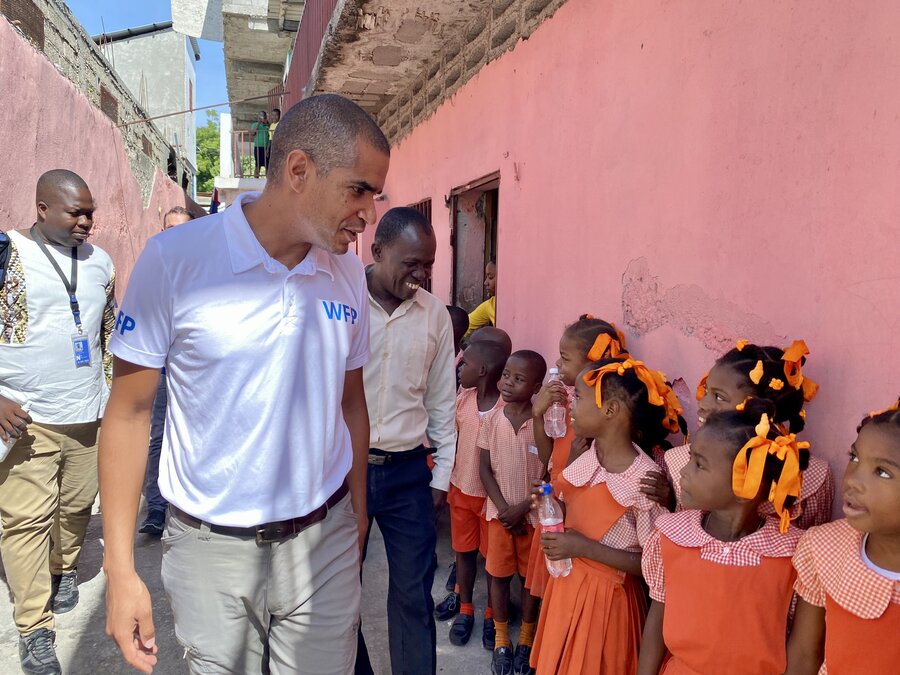 WFP Haiti Country Director Jean-Martin Bauer chats with kids benefitting from WFP school meals in Jeremie, Haiti.  Photo: WFP/Tanya Birbeck