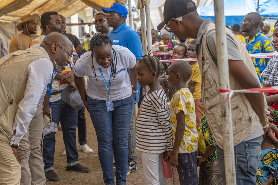 WFP Country Director Peter Musoko speaks to displaced kids in eastern DRC's Ituri province. Photo: WFP/Benjamin Anguandia