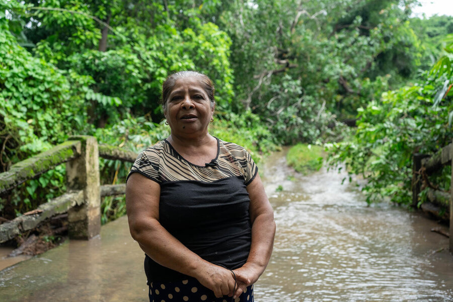 Lady in flooded area in El Salvador