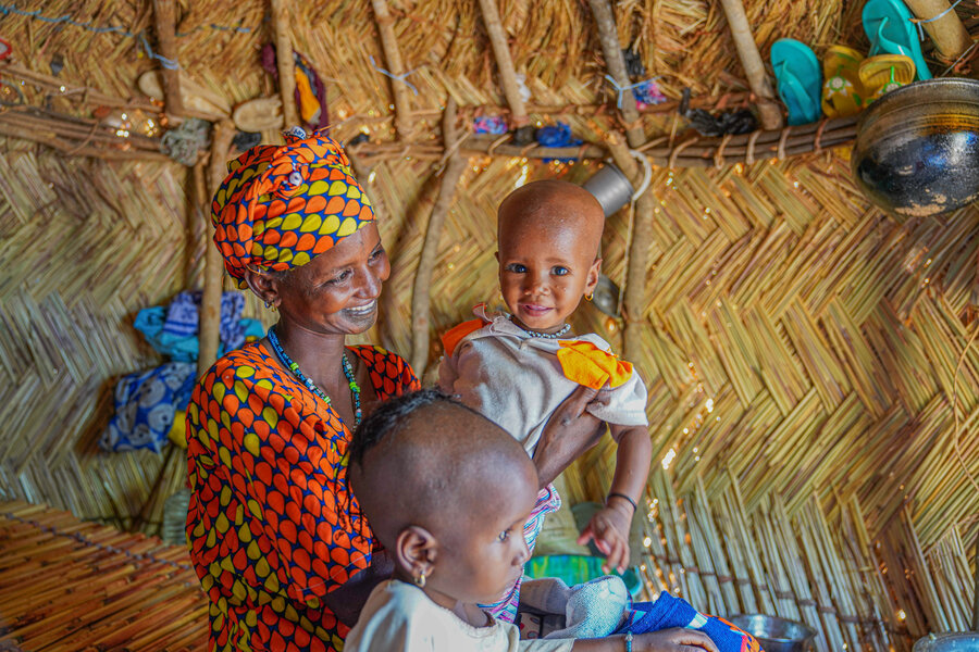 Burkinabe asylum seeker Rainatou with her children at their new home in Côte d'Ivoire. Photo: WFP/Richard Mbouet