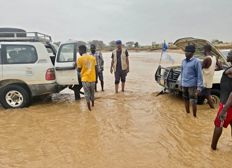 UN humanitarian vehicles trying to cross a rushing wadi, or seasonal river, during the August rainy season. Photo: WFP