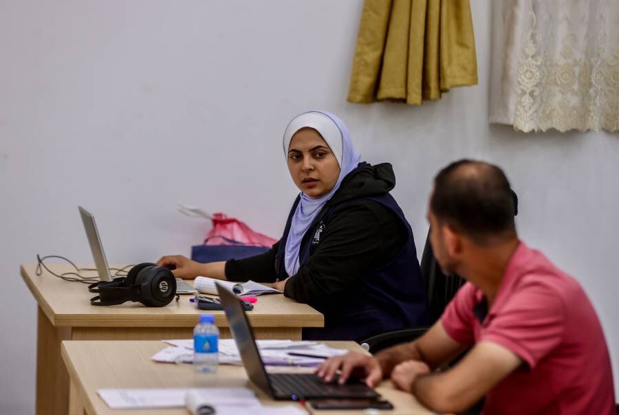 Amal Abushammala says her WFP colleagues try to make a good work environment, despite their losses and hardship. Photo: WFP/Nour Hammad