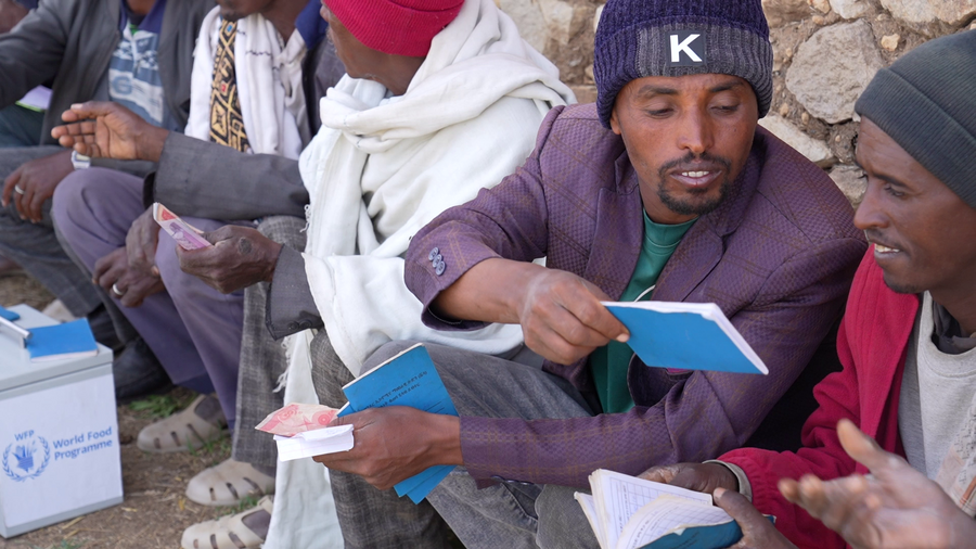 Farmer Negash with his village savings group, where he first learned about the crop insurance scheme. Photo: WFP/Michael Tewelde