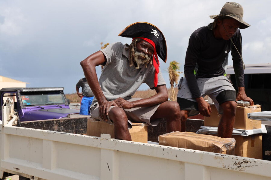 Like many in the Caribbean, Coris Dember (L), otherwise known as Captain Harris, is trying to rebuild his home and tourism business months after Hurricane Beryl. Photo: WFP/Bryanna Hadaway