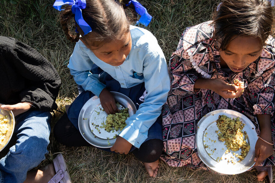 Children tuck into WFP food in Nepal, where child malnutrition is high. Photo: WFP/Samantha Reinders