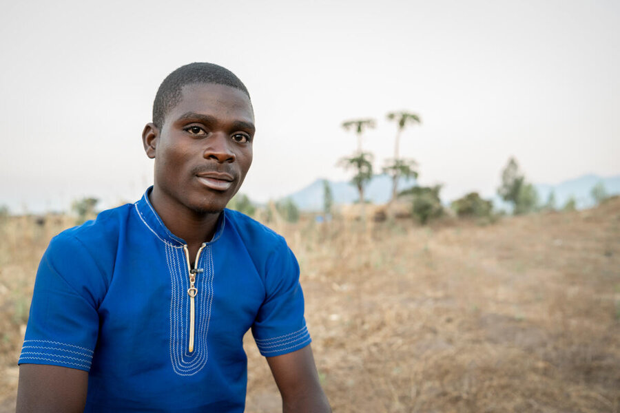 Maxwell a farmer in Malawi speaks in a scorched field