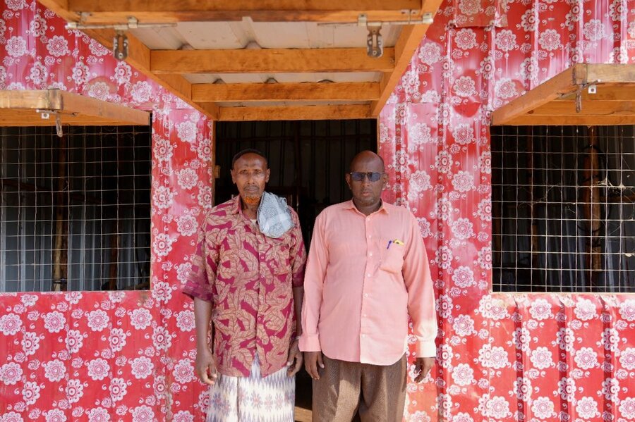 Abdirashid Ali (R) and his business partner Ahmed Ibrahim (L) are proud of their sesame processor, which helps turn the seed into a prized oil. Photo: WFP