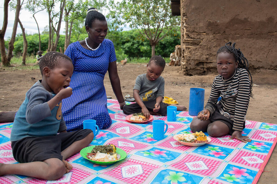 Ugandan school cook and mother Esther Angolere serves up sweet potatoes to her kids. The tuber has taken off in her native Karamoja region. Photo: WFP/Joel Eckstrom