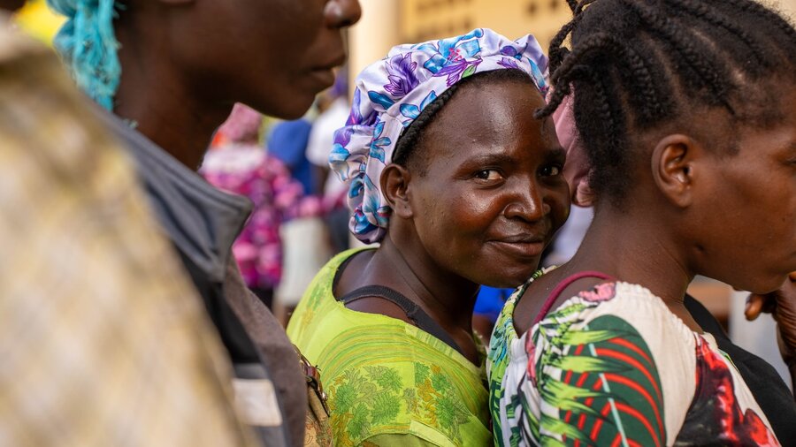 "It's a hard life, but it's still a gift," says Mireille, here awaiting WFP food assistance. Like many Haitians, she hopes for a better future. Photo: WFP/Pedro Rodrigues