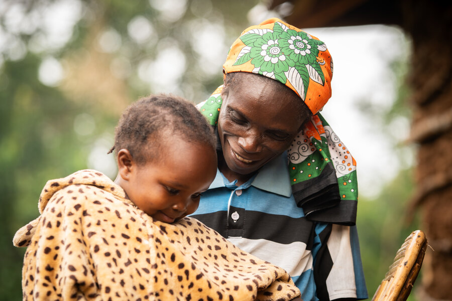 Catherine Wanjala with one of her children. During hard times, her family only ate once a day. Photo: WFP/Lisa Murray