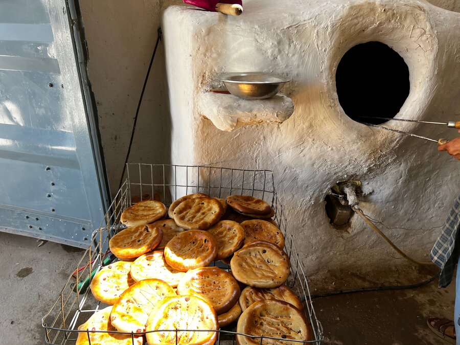 Crusty naan bread out of the oven at the Sharifa sisters' bakery. Their output has soared thanks to a larger tandoor oven supplied by WFP. Photo: WFP/Rana Deraz