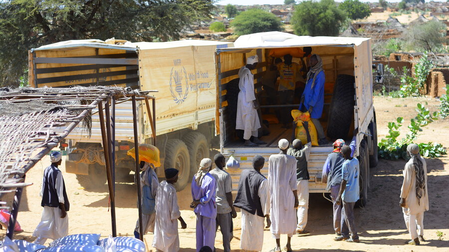 Trucks unload in Zamzam