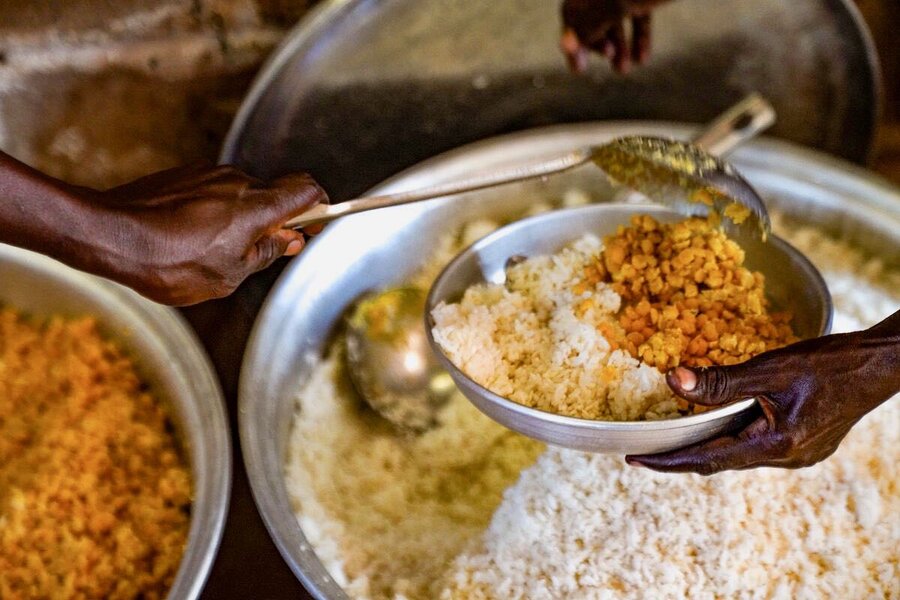 A hearty meal at Betokomia 1 primary school featuring rice and yellow beans. WFP's school feeding initiative will soon be extended to other schools in Lim-Pende prefecture. Photo: WFP/Marie Dasylva