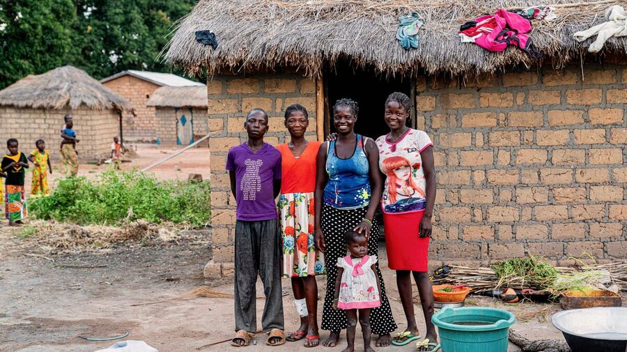 Pelagie Homdoyote (second to right in blue) and her children returned to CAR after spending years in exile in Cameroon. The WFP school meals are sometimes the only ones her kids eat all day. Photo: WFP/Marie Dasylva