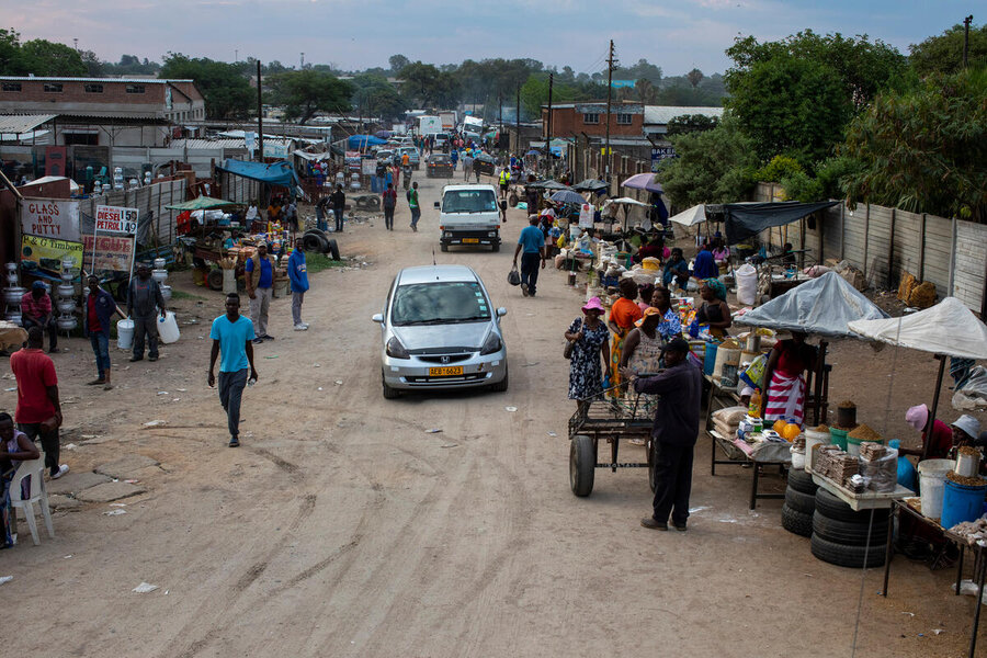 Bustling Erenkini market in Bulawayo, Zimbabwe. One of the many places where people face hardship - yet offer kindness and generosity. WFP/Cynthia Matonhodze