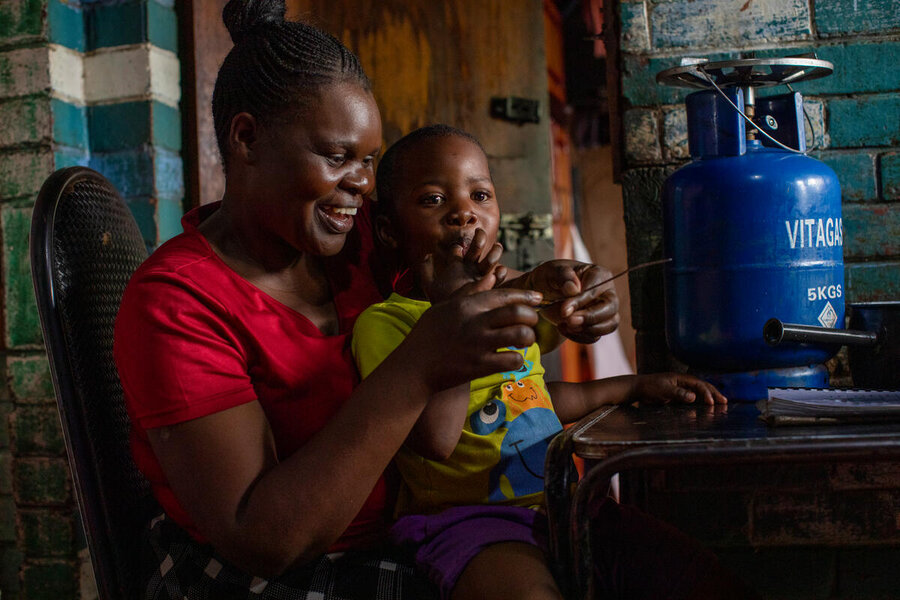 Edith Ndebele with her youngest son, Teboho, after whom she named her peanut butter business. WFP/Cynthia Matonhodze