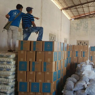 WFP members check the food (rice, grains, and oil) stored in Pinar del Río and destined for the people affected in that province by hurricane Ian in 2022.