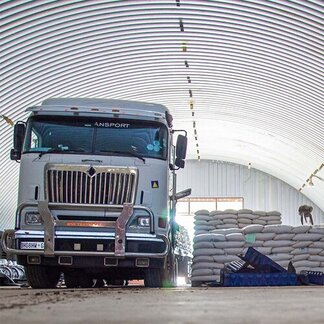 Pulses being offloaded at WFP warehouse.