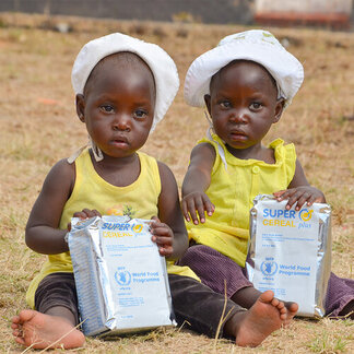 Two kids with WFP food