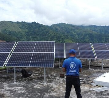 Nepal. WFP Engineer supervises the installation of solar panels in schools as part of the Green Cooking Pilot. WFP/Biplob Rakhal